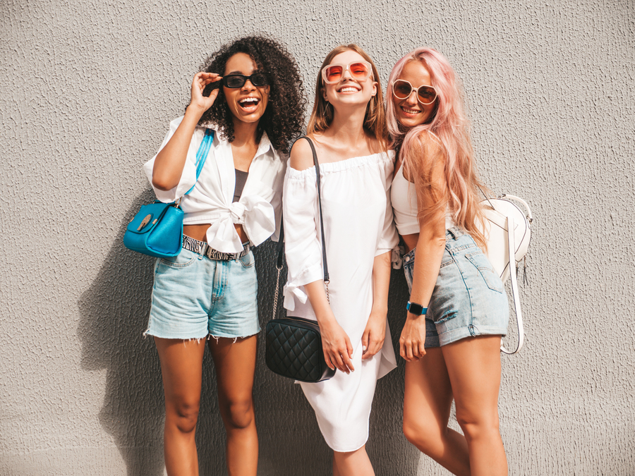 Center three young beautiful smiling female trendy summer clothessexy carefree multiracial women posing street backgroundpositive models having fun sunglasses cheerful happy